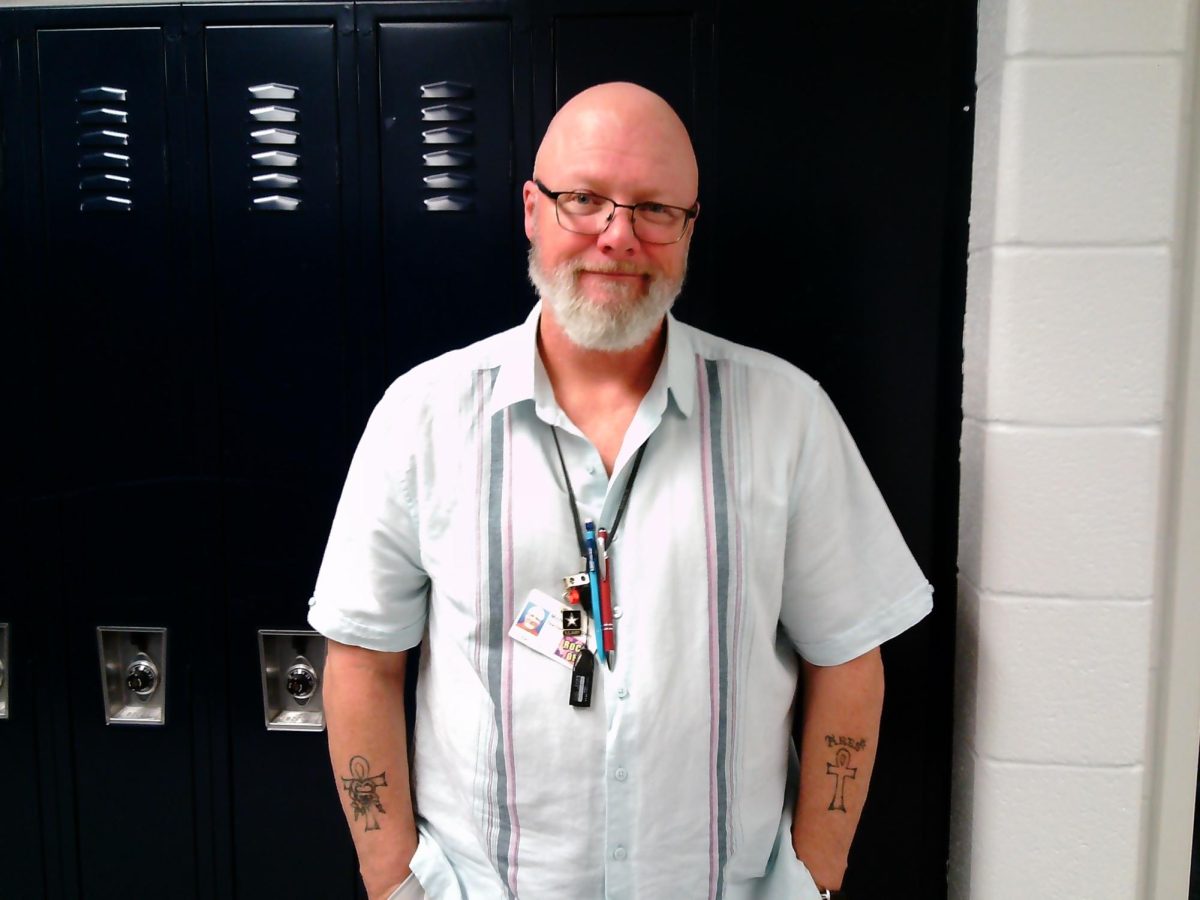 Mr. Brown, Honors English 9 teacher at Landstown, stands for a picture.